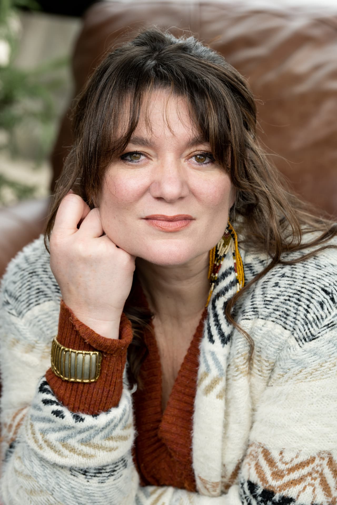 Portrait of Dr. Danielle Gettings resting her chin on her hand