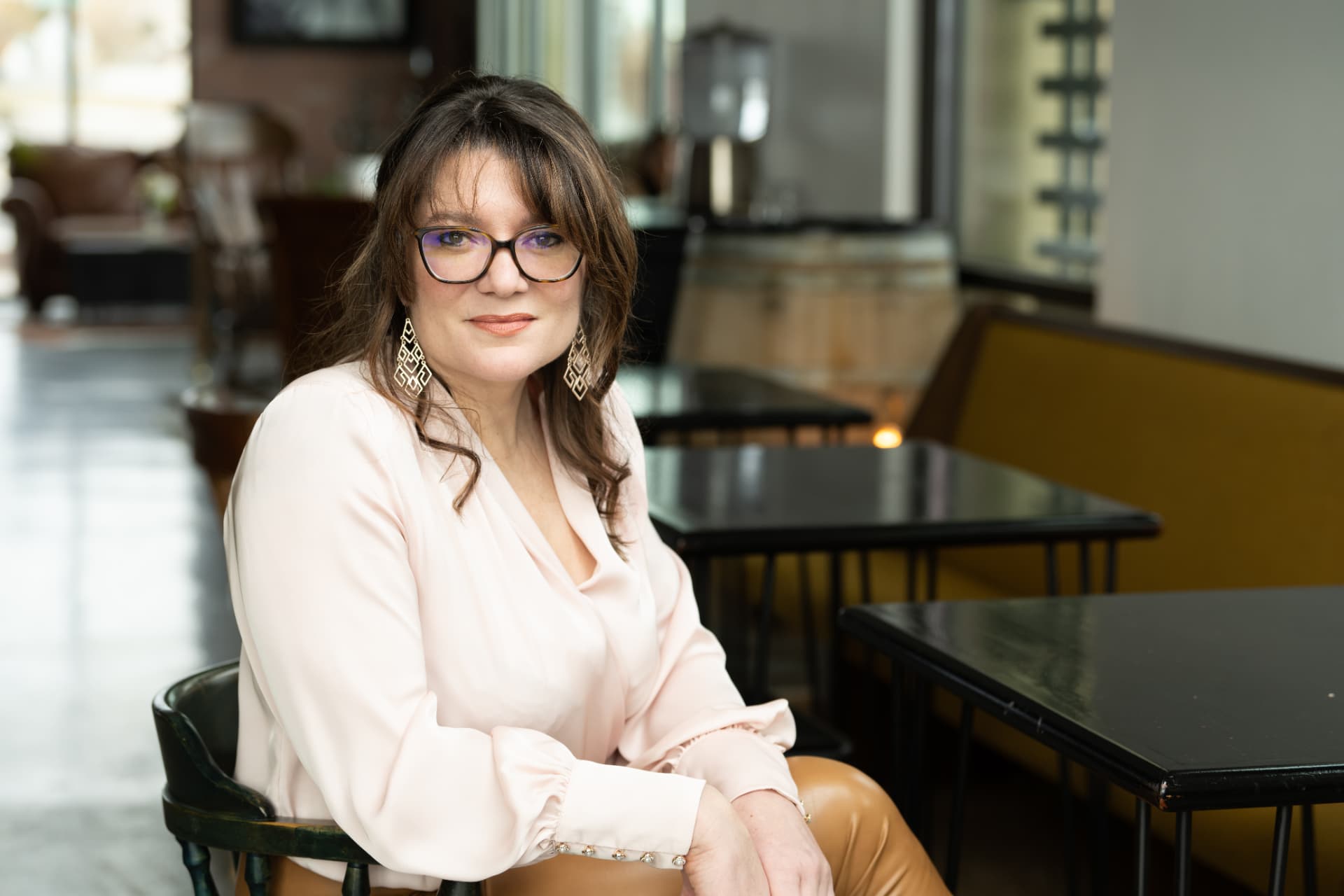Dr. Danielle Gettings seated at a table, looking toward the camera